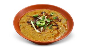 Beef haleem in Dubai topped with fried onions, ginger and lemon – B&B Restaurant